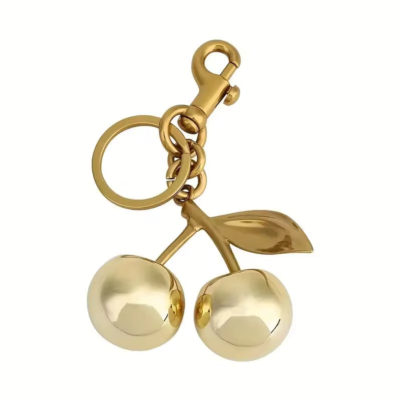 GOLDEN CHERRY BAG CHARM