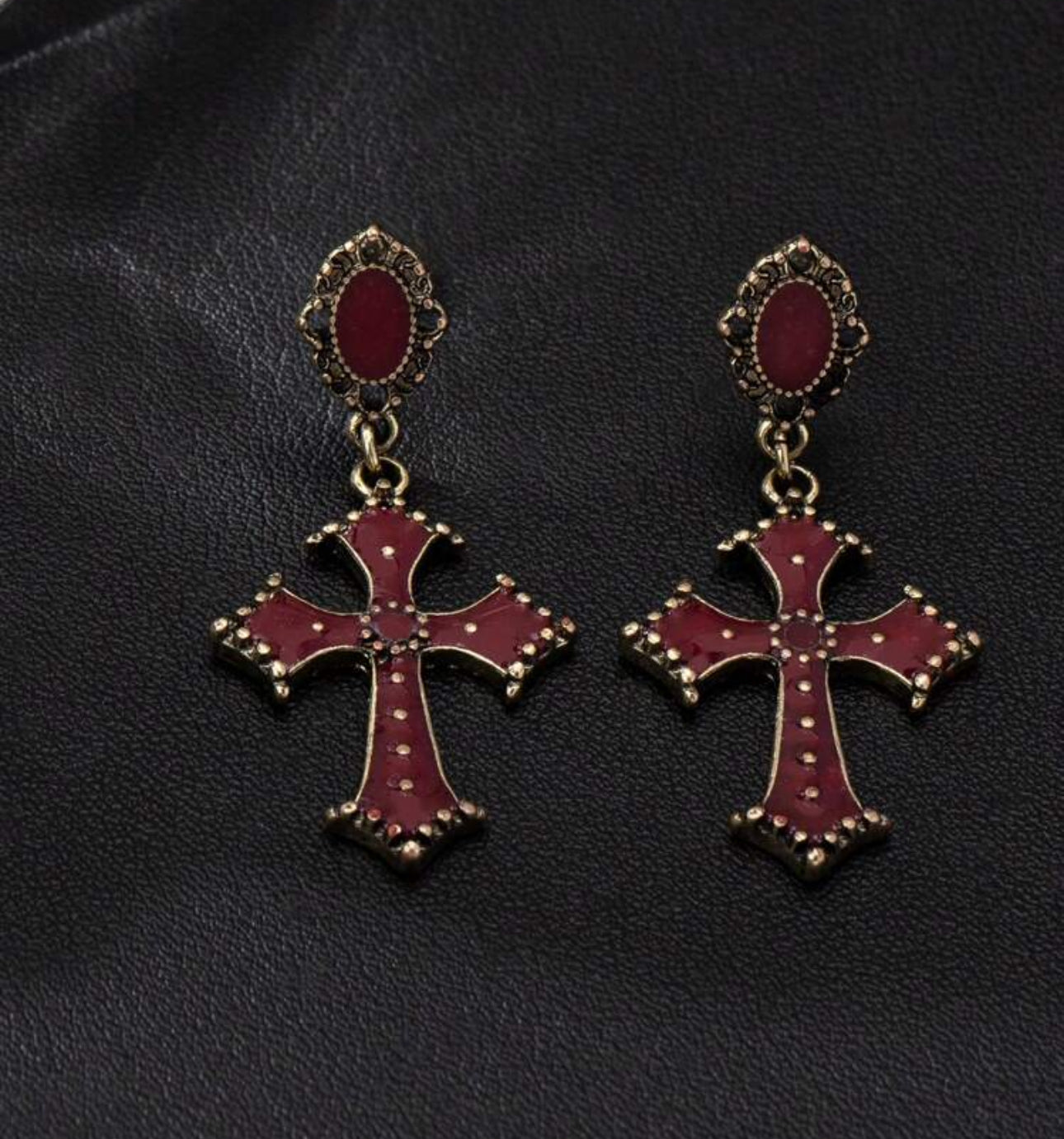 CROSS HUB EAR RINGS.